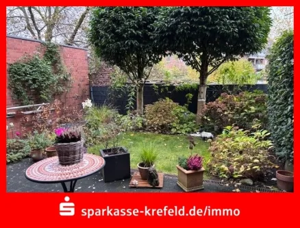 Terrasse und Garten - Wohnung kaufen in Kempen - Vermietete 3-Zimmer-Erdgeschosswohnung mit TG-Stellplatz