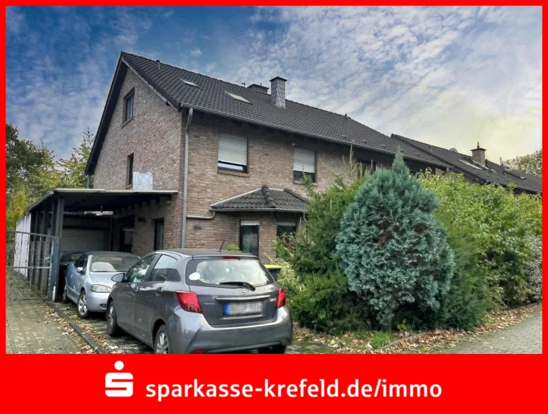 Außenansicht - Haus kaufen in Duisburg - Doppelhaushälfte mit Garage und Carport