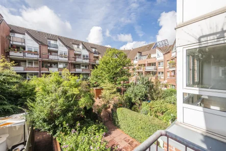 Blick ins Grüne - Wohnung kaufen in Neuss - Moderne 3-Zimmer-Wohnung mit Loggia und Tiefgarage in der Neusser City