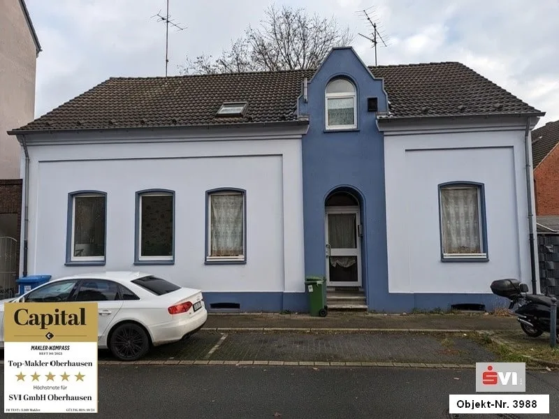 Vorderansicht - Haus kaufen in Oberhausen - 4-Familienhaus mit kleinem Gewerbe und viel Potential in Oberhausen-Styrum