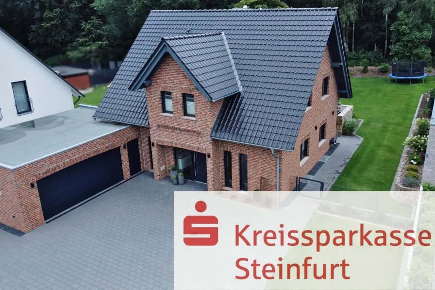 Straßenansicht - Haus kaufen in Mettingen - Exklusives Familienhaus mit gehobener Ausstattung - Smart Home - und geringem Energieverbrauch