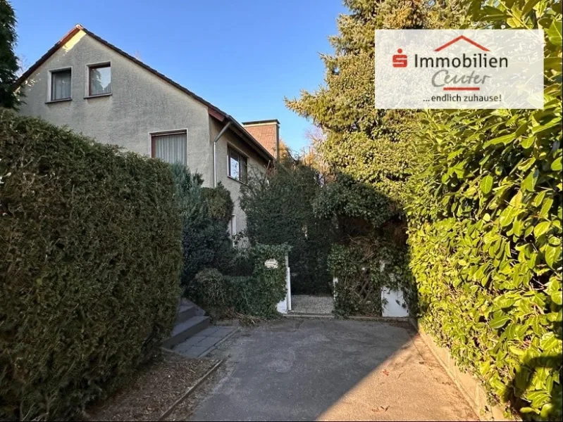 Seitenansicht - Haus kaufen in Hagen - Freistehendes Einfamilienhaus mit 274 qm Wohnfläche in ruhiger grüner Lage von Hagen-Tücking