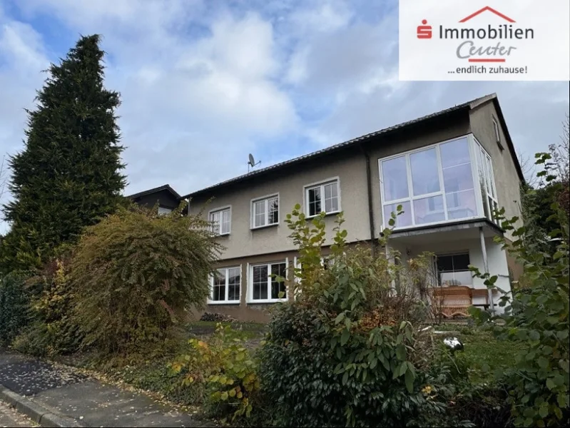 Straßenansicht Bild 1 - Haus kaufen in Hagen - Freistehendes Einfamilienhaus mit Pkw-Garage  in ruhiger grüner Wohnlage von Hagen-Dahl