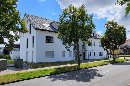 Hauptansicht - Wohnung kaufen in Hiddenhausen - Vermietete Neubauwohnungen: einzeln oder im Dreierpack!