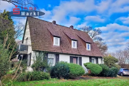 Ansicht Straße - Haus kaufen in Stemwede - Naturnah wohnen in Ortsrandlage!