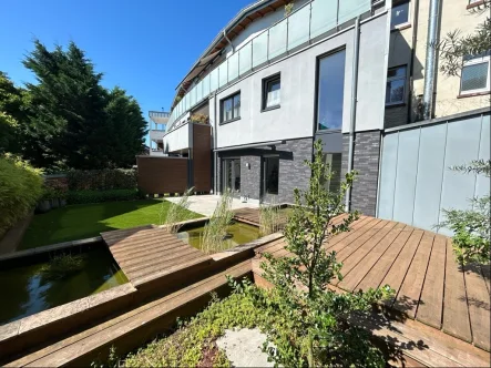 Rückansicht - Wohnung kaufen in Bocholt - Maisonette mit schön angelegtem Garten und Tiefgaragenstellplatz