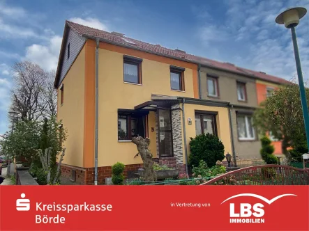 Außenansicht - Haus kaufen in Oschersleben - Familienfreundliches Reihenendhaus*Wintergarten*Garage*