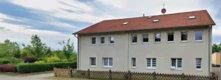 Straßenansicht - Haus kaufen in Seegebiet Mansfelder Land - Mehrfamilienhaus in Röblingen! 