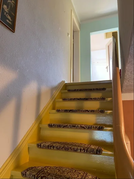 Treppe zum Obergeschoss