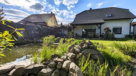 Gartenansicht - Haus kaufen in Luckau - Traumidylle: Freistehendes Einfamilienhaus mit gepflegten Garten und Doppelgarage in sehr guter Wohnlage von Luckau