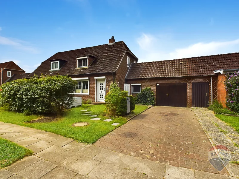 Titelbild - Haus kaufen in Brunsbüttel - Charmante Doppelhaushälfte mit Wintergarten und großem Garten – Ihr neues Zuhause in Brunsbüttel!