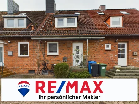 Titelbild - Haus kaufen in Neumünster - Solides Renditeobjekt: Charmantes 2,5-Zimmer-Haus mit langfristigem Mietpotenzial