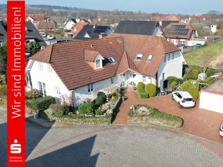 Frontansicht - Haus kaufen in Ostercappeln - Mehrgenerationenhaus mit neuer Luftwärmepumpe!