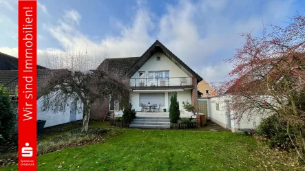 Gartenansicht  - Haus kaufen in Osnabrück - Solides Zweifamilienhaus mit Baulandreserve