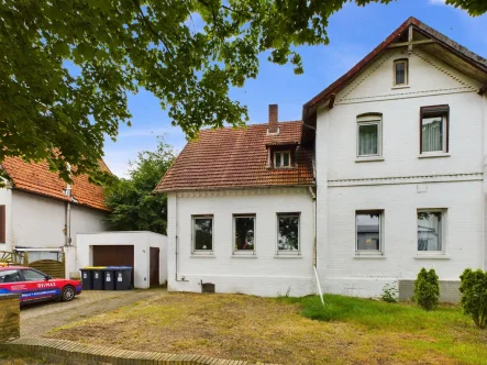 Titelbild - Haus kaufen in Häuslingen / Groß-Häuslingen - Handwerkerhaushälfte mit Potential - großes Grundstück, ländliche Lage