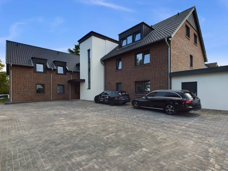 Titelbild - Wohnung kaufen in Wedemark / Mellendorf - 3-Zimmer Erdgeschosswohnung mit Balkon - Neubau mit Sonderabschreibung!