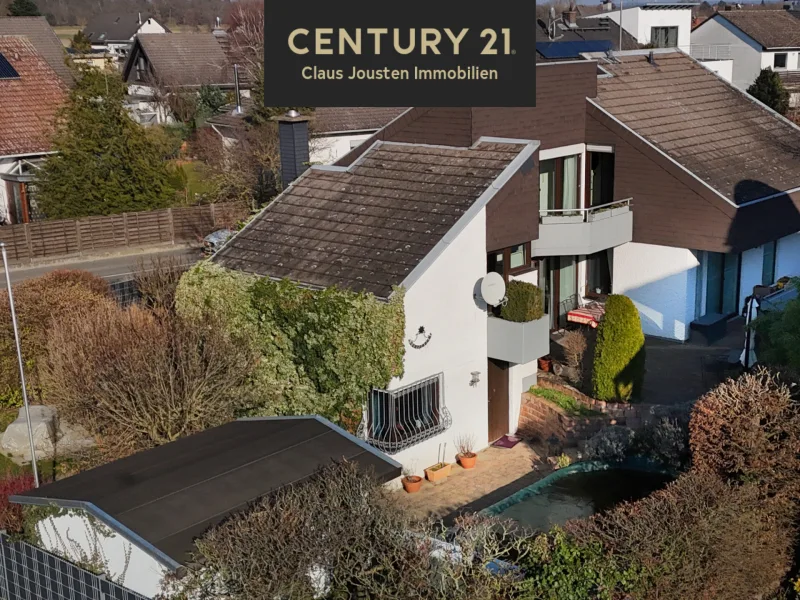 Hausansicht - Haus kaufen in Büttelborn Klein-Gerau - Einzigartiges Split-Level-Einfamilienhaus mit Einliegerwohnung