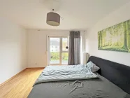 Schlafzimmer mit Ausgang zum Balkon