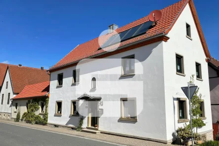 Ansicht - Haus kaufen in Hammelburg - Modernisiertes Einfamilienhaus mit umfangreichen Nutzflächen und separatem Garten