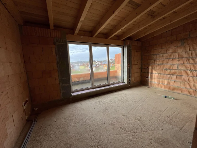 Elternschlafzimmer im Obergeschoss mit Dachterrasse