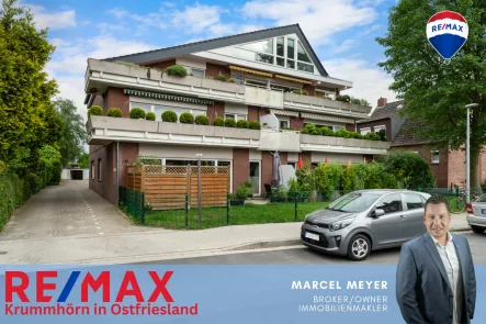 Titelbild - Wohnung kaufen in Emden - Charmante Maisonettewohnung in Wolthusen: Kanalnähe, großer Balkon, und energetischer Wohnkomfort