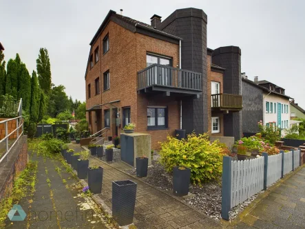 1 - Haus kaufen in Mülheim an der Ruhr - Exklusives Reiheneckhaus mit idyllischem Garten in MH-Dümpten