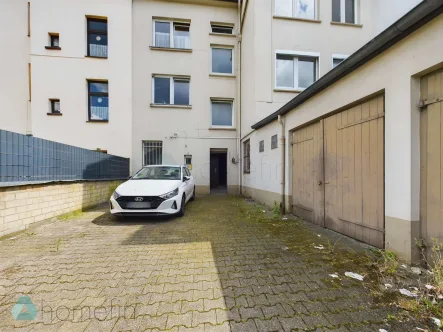 Garagenhof - Haus kaufen in Essen - Grundsolides Mehrfamilienhaus in Essen-Stoppenberg