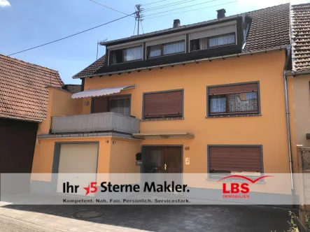 Außenansicht - Haus kaufen in Breitenheim - Reihenmittelhaus mit Balkon, Garage und Garten 