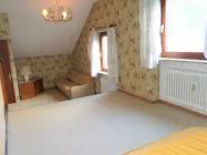 Schlafzimmer mit Sitzbereich