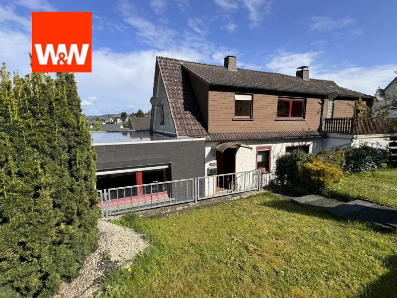 Einfamilienhaus mit Garten und Garage  - Haus kaufen in Breidenbach - Geräumige Doppelhaushälfte in Breidenbach mit Garage und Garten