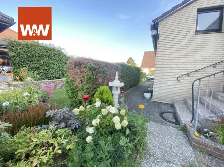 Bitte hier entlang - Haus kaufen in Tappenbeck - Modernisierter, gepfl., unterkellerter Bungalow auf schönem Grundstück (Erbbaurecht) in ruhiger Lage