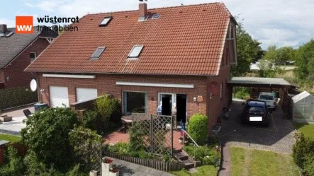 Hausansicht - Haus kaufen in Meine OT Abbesbüttel - Ideal für eine kleine Familie ist diese schön gelegene, gepfl. DHH mit Carport u. schönem Grundstück