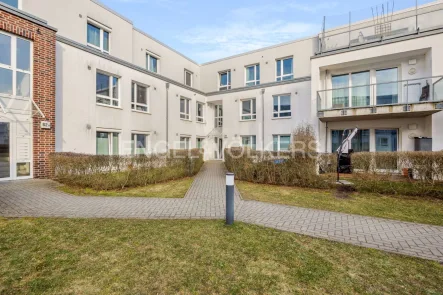 Hauseingang Innenhof - Wohnung kaufen in Hamburg - Attraktive 3-Zimmer-Wohnung mit Balkon in zentraler Lage von Bergedorf