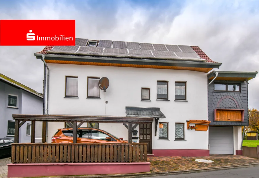 Straßenansicht - Haus kaufen in Waldbrunn - Gemütliches Einfamilienwohnhaus mit Carport und Garage als Werkstatt in Waldbrunn-Lahr