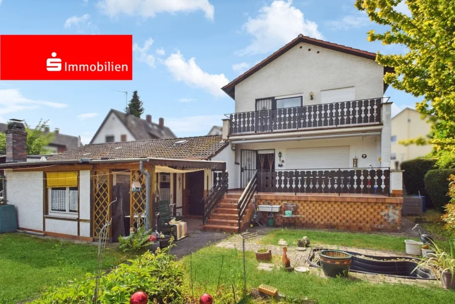 Ansicht 1 - Haus kaufen in Rodgau - 1-2-Familienhaus in Rollwald