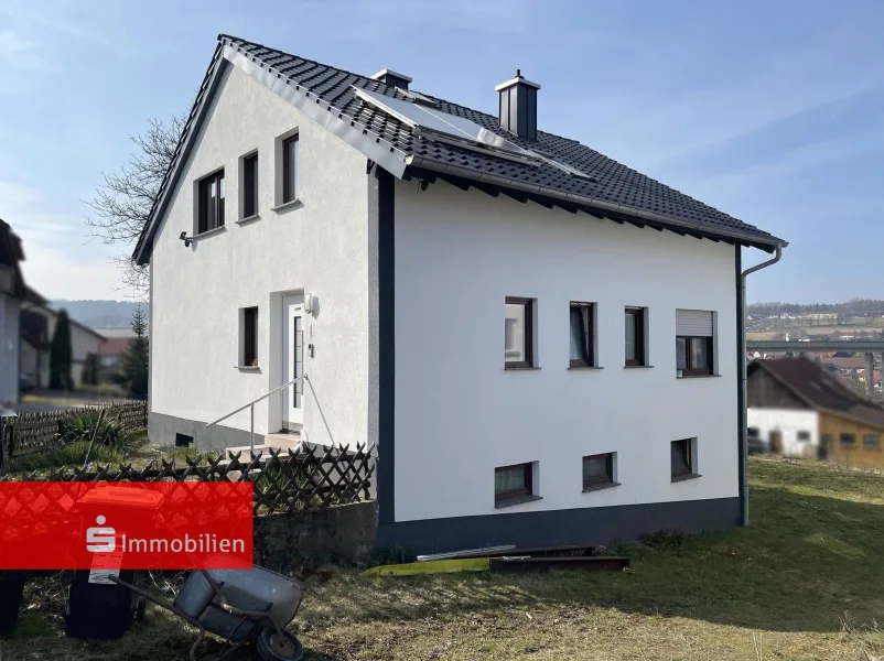 Einfamilienhaus in Uttrichshausen - Haus kaufen in Kalbach - Modernisiertes Einfamilienhaus in Uttrichshausen mit Wintergarten & großem Grundstück