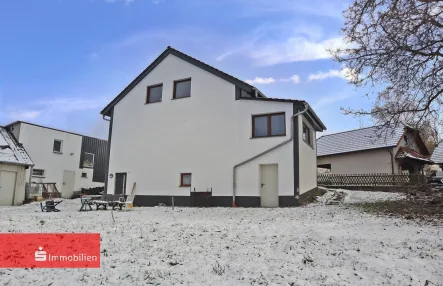 Einfamilienhaus in Uttrichshausen - Haus kaufen in Kalbach - Modernisiertes Einfamilienhaus in Uttrichshausen mit Wintergarten & großem Grundstück