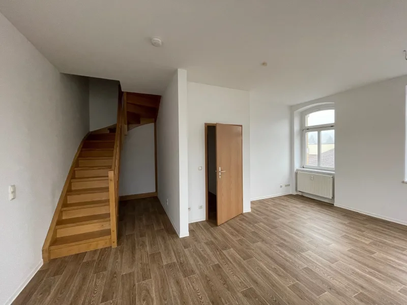 3 - Wohnzimmer Treppe zur oberen Etage