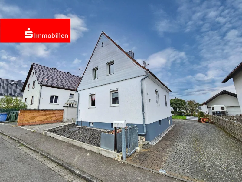 Außenansicht 1 - Haus kaufen in Langgöns - Einfamilienhaus mit Garten für die kleine Familie in Langgöns-Oberkleen