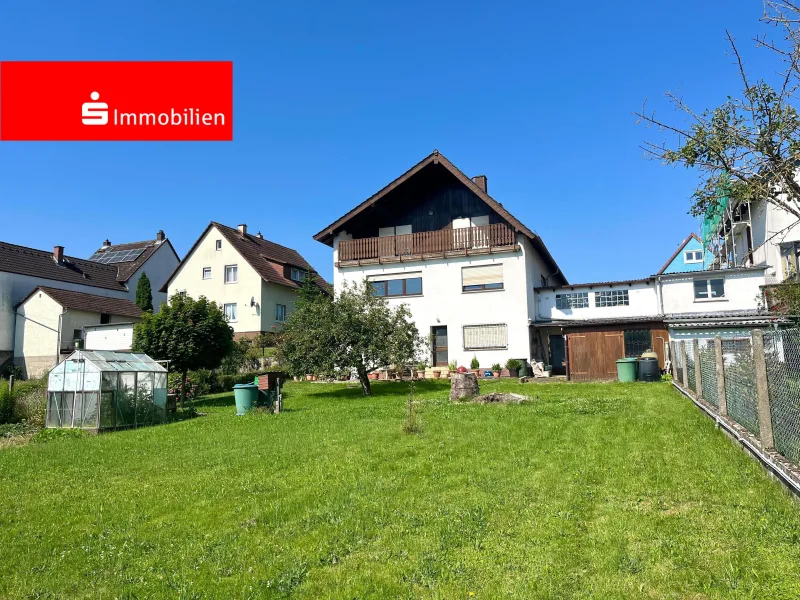 Gartenansicht - Haus kaufen in Pohlheim - Gepflegtes Haus mit zwei getrennten Wohneinheit in Pohlheim-Grüningen