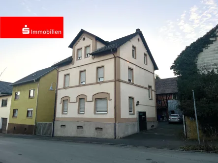 Außenansicht - Haus kaufen in Heuchelheim - Charmantes Einfamilienhaus mit Potenzial in Heuchelheim-Kinzenbach