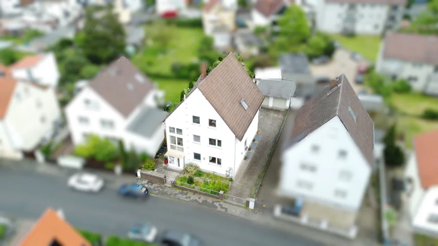 Haus von oben - Zinshaus/Renditeobjekt kaufen in Langen - Spannendes Familienhaus mit ELW in Toplage von Langen !