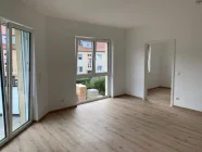 Wohnzimmer mit Blick in die Küche