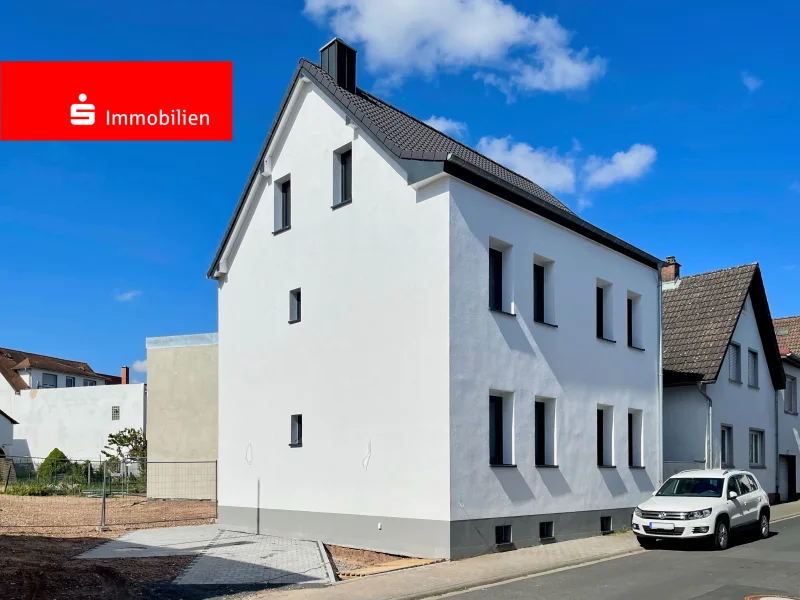 Außenansicht - Wohnung kaufen in Dietzenbach - Moderne Erdgeschosswohnung in Dietzenbach: Frisch saniertes Wohnjuwel