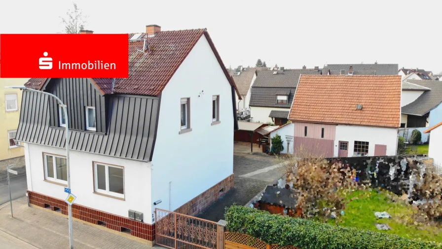 Kleines Anwesen mit vielen Möglichkeiten... - Haus kaufen in Mainhausen - Kleines Anwesen mit vielen Möglichkeiten! 2-Familienhaus mit großer Scheune und idyllischem Garten!