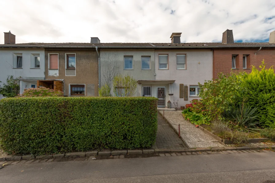 Außenansicht - Haus kaufen in Waltrop - Charmantes Reihenhaus in der Waltroper Klöcknersiedlung