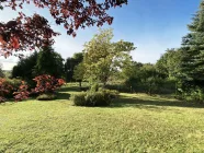 Garten mit Blick in die weite und unberührte Natur