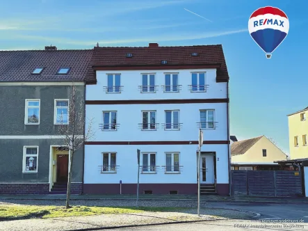 Straßenansicht - Haus kaufen in Genthin - Gepflegte Kapitalanlage in zentraler Lage!