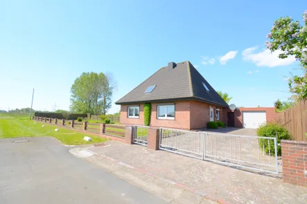 Außenansicht  - Haus kaufen in Neuenkirchen - Gepflegtes Einfamilienhaus mit Feldblick in Neuenkirchen