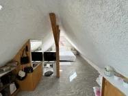 Separates Schlafzimmer im Dachgeschoss